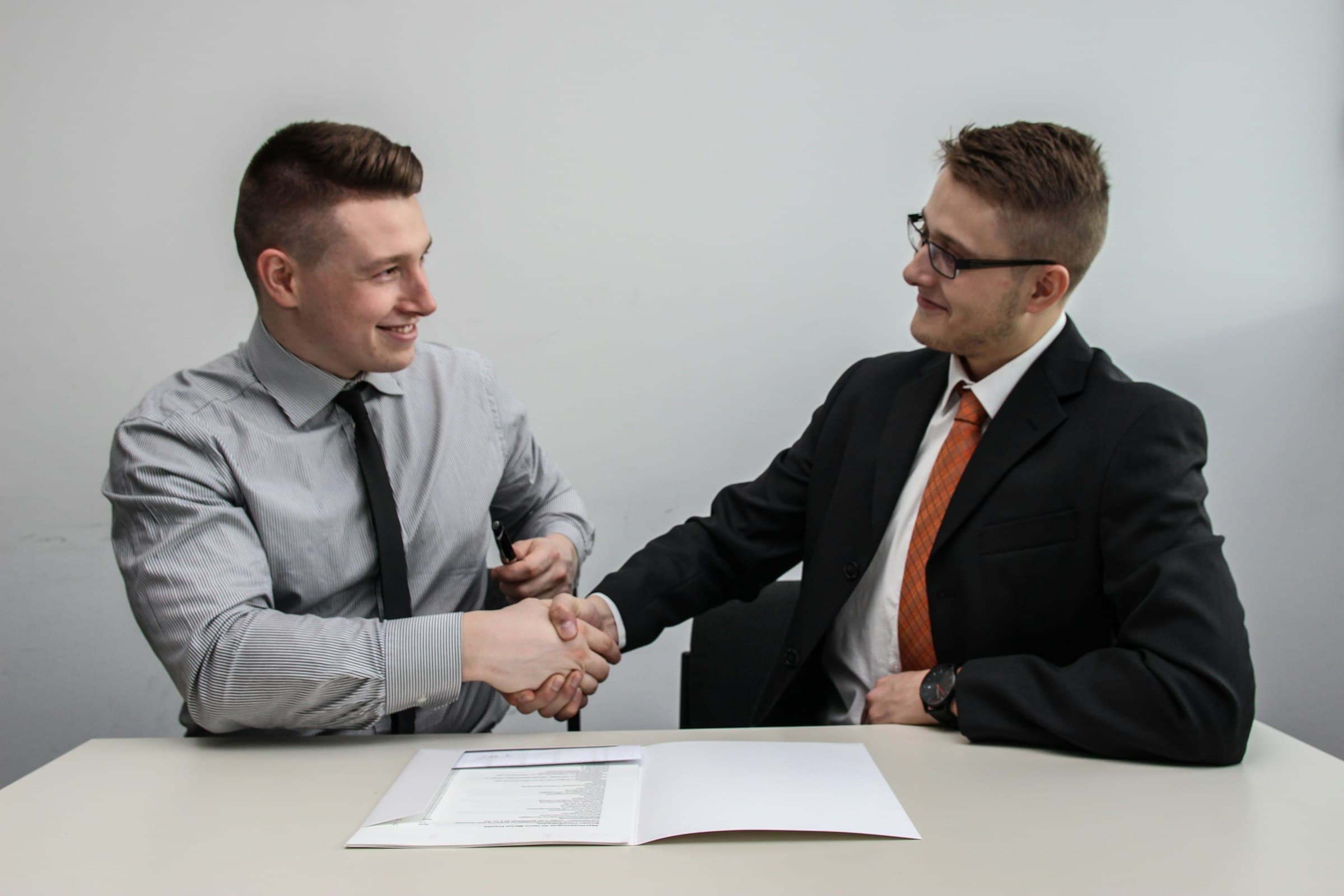 Two professionals shaking hands after agreeing the next steps on a project opportunity